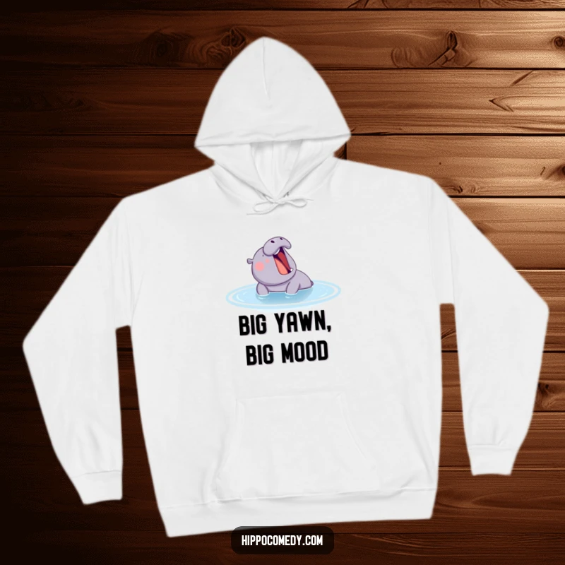 A large, funny hippo yawning contentedly in a tranquil blue pond, printed on a soft hoodie for maximum comfort and humor.